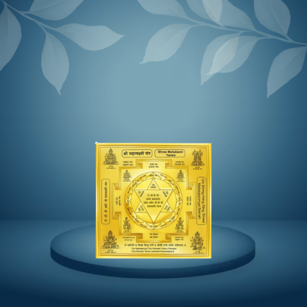 Gold-colored decorative item with intricate designs on a blue background